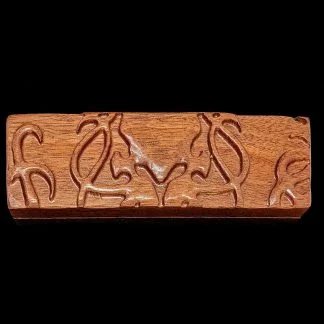 Hardwood dice sheath cover with carved image of Cthulhu
